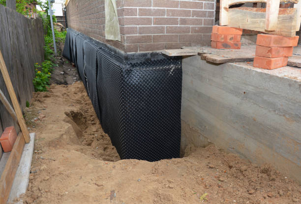Happy homeowners after waterproofing job in Hingham